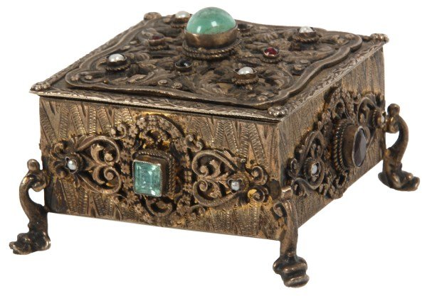 Hinged Silver & Jeweled Ring Box: Hinged Silver & Jeweled Ring Box. Silver box has a gold washed and velvet lined interior, has engraved sides, pierced decorated filigree mounts, 4 dolphin feet and bezel set pearls and jewels which ap