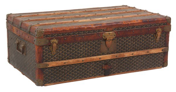 E. Goyard Aine Flat Top Steamer Trunk: E. Goyard Aine Flat Top Steamer Trunk. Canvas covered trunk with leather wrapped edges, brass bound corners and wood straps along the top, bottom, front and back with brass tacks; has original brass s