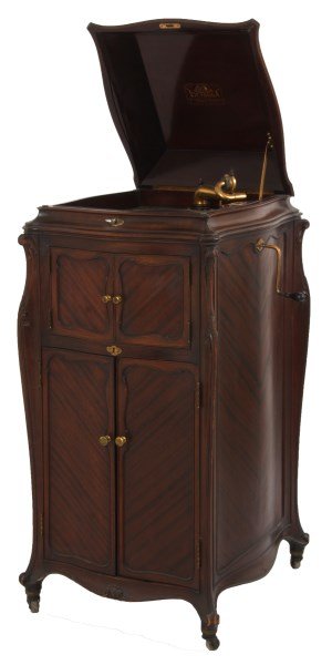 Victor Model XVIII Mahogany Phonograph: Victor Model XVIII Mahogany Phonograph. Floor standing carved mahogany Louis XV style case has a hinged lid, 2 doors in front of the speaker horn and 2 doors in the base with record storage in the int