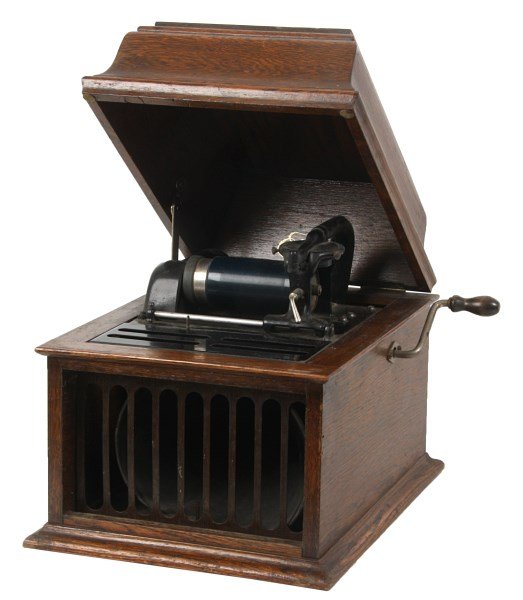 Edison Amberola Model 30 Cylinder Phonograph: Edison Amberola Model 30 Cylinder Phonograph. Oak case has a hinged lid with Edison decal inside and pierced decorated tin grill in front of the tin horn enclosed in the base; iron bedplate and cover 