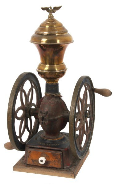 Enterprise No. 5 Coffee Grinder: Enterprise No. 5 Coffee Grinder. Cast iron coffee grinder has 12.5 in. pierced decorated wheel signed “Enterprise Mfg. Co., Philadelphia, PA, U.S.A.; spun metal hopper with brass washed finish on a 
