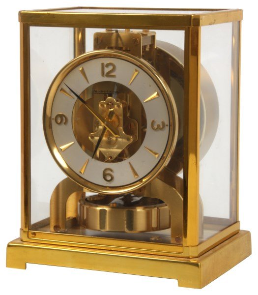 Jeager Le Coutre Atmos Clock: Jeager Le Coutre Perpetual Atmos Clock. 5 in. dial has applied gilt brass 5 minute markers, gilt hands, pendulum and case. Has glass on all sides and the top. Case is in overall good condition, clock 