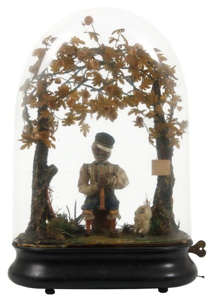 French Musical Figural Monkey Automaton: French Musical Figural Monkey Automaton. Seated figure of a monkey rocking back and forth, nods & turned his head, brings his instrument up to his mouth and back down, blinks his glass eyes and moves 