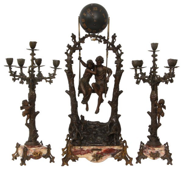 3 Pc. French Mystery Swinger Clock Set: 3 Pc. French Mystery Swinger Clock Set. Titled Idylle Printaniere (Idylls of Spring) by Geo Maxim; spelter sculpture with 2 tall tree trunks on a hill, branching up and entwined in an arch at the top,