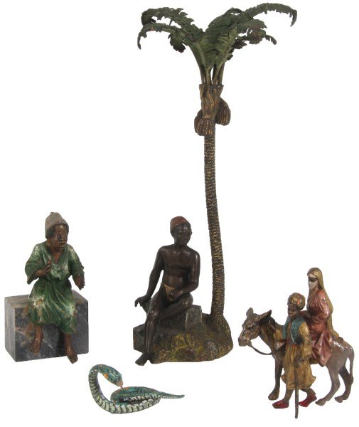 4 Pcs. Miniature Cold Painted Bronze Figures: 4 Pcs. Miniature Cold Painted Bronze Figures. 1) Figure of a boy seated on a rock under a palm tree, marked “Geschutzt”, 8.5 in. high. 2) Grouping depicts a man escorting his bride on the back of