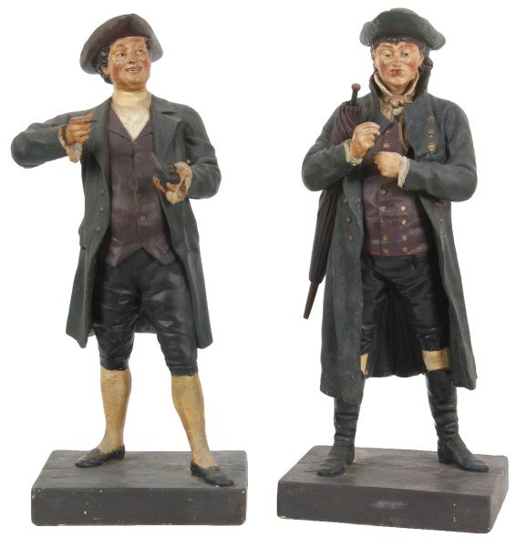 Pr. Max Bachmann Tobacconist Figures: Pr. Max Bachmann Standing Cigar Store Figures. Standing figures of men in colonial dress. Figures are in nice condition with some touchup, repairs at the legs of both and hat brim of one, signed “Ma