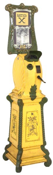 Coin Op Floor Model Mutoscope Viewing Machine: Coin Op Floor Model Mutoscope Viewing Machine. Cast iron floor standing case with large seashell panels on the sides, green filigree, the pedestal base has spiral turned corner columns with filigree a