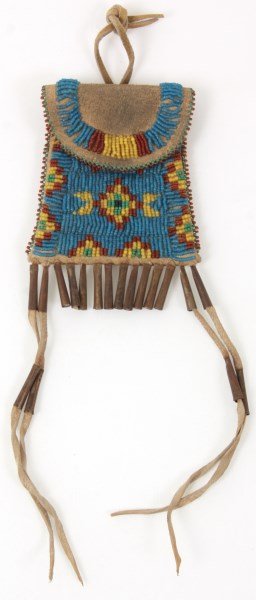 Sioux Beaded Flint Bag: Sioux Beaded Flint Bag. Native American hide flint bag with beaded front design and hanging tassels with tin cones. 5 in. high x 3.75 in. wide. Weight: 2.75 oz.