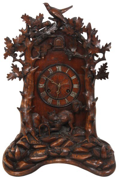 Black Forest Carved Cuckoo Table Clock, attr. Beha: Attr: Johann Baptist Beha Black Forest Carved Cuckoo Table Clock. 6 in. wood dial with incised and painted Roman hour numerals and pierced brass hands; double fusee spring driven movement has wooden s