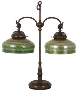 Tiffany Green Damascene Double Student Lamp: Tiffany Green Damascene Double Student Lamp. Pr. of excellent 10 in. dia. damascene shades having a lobed form in deep green glass with an opaque interior, has a silver iridescent exterior surface wit