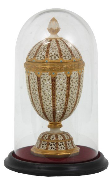 Grainger & Co. Reticulated Porcelain Urn: Grainger & Co. Reticulated Porcelain Urn. Beautiful covered urn has an egg form with pineapple finial on the domical lid, a short stem and on a raised base; pieced decorated filigree panels with gilt 