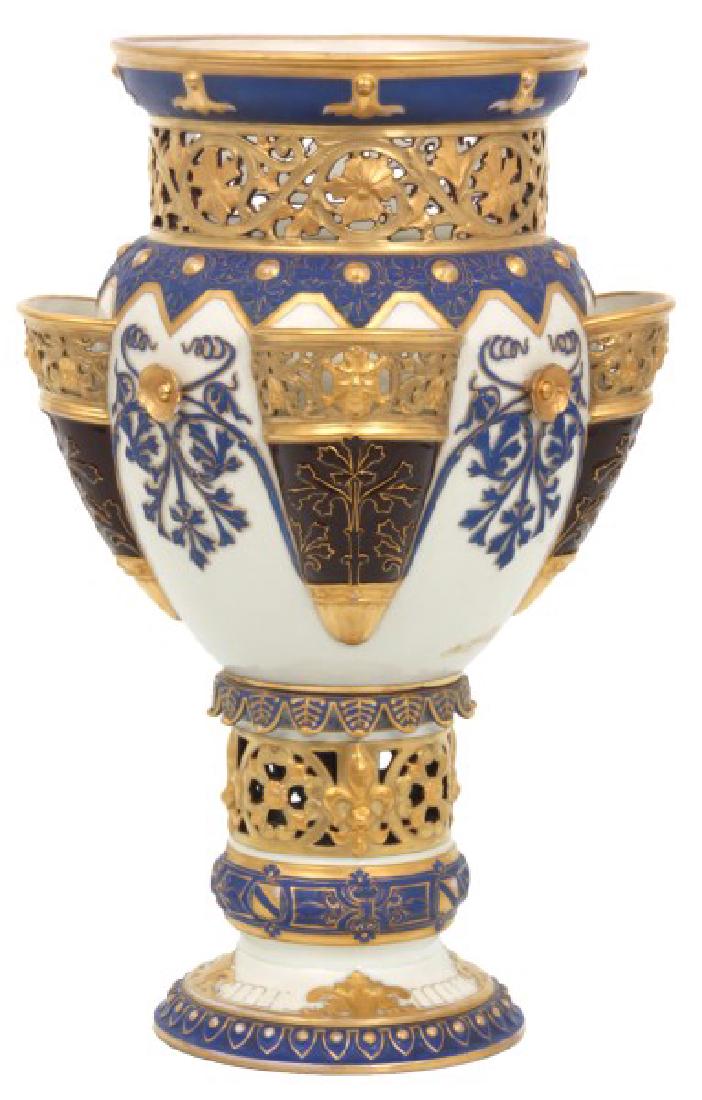 Large Pierced Decorated Porcelain Vase: Large Pierced Decorated Porcelain Vase. Large and beautiful center vase Attr: Fischer & Mieg of Pirkenhammer, Bohemia; with applied gilt rosettes between cornucopia shaped flower holders on the sides,