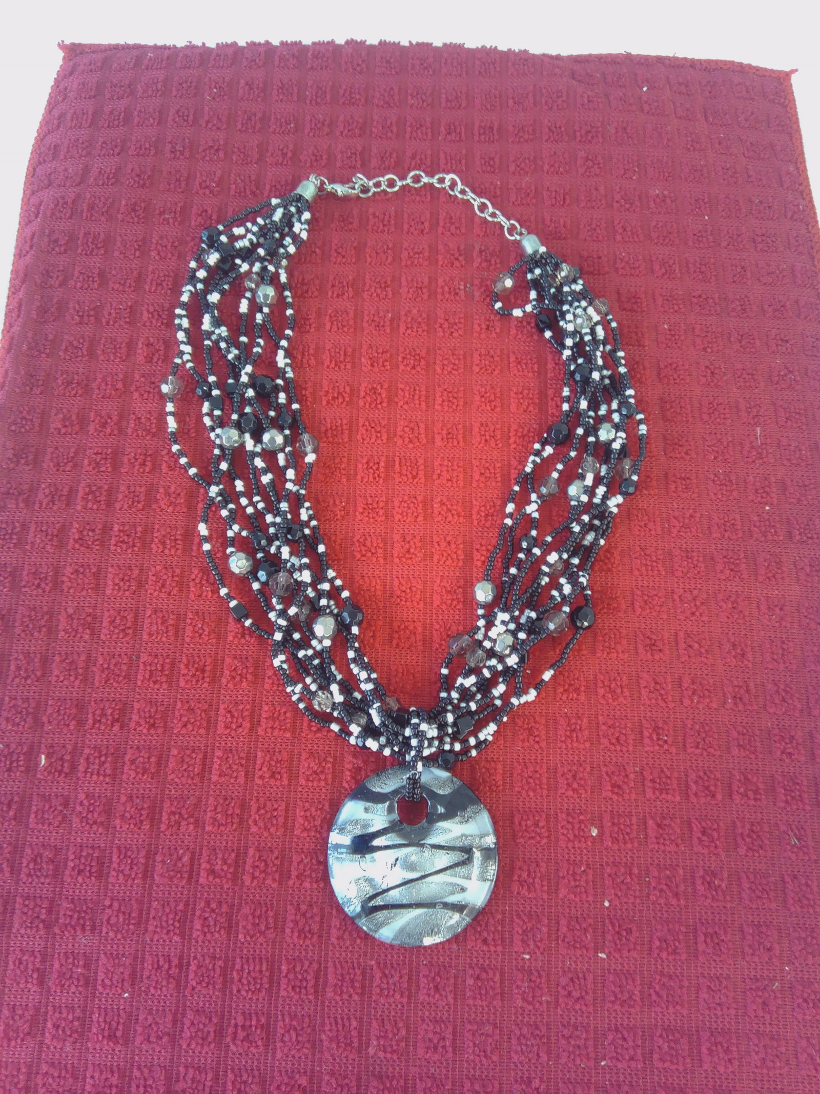 Jills Coins and Collectibles: This Beautiful Vintage Black and White Multi Strand Glass beaded Necklace is just stunning. It features 10 Hand strung acrylic beads, featured by Glass black,white and gray drop pendant drop.With a lo