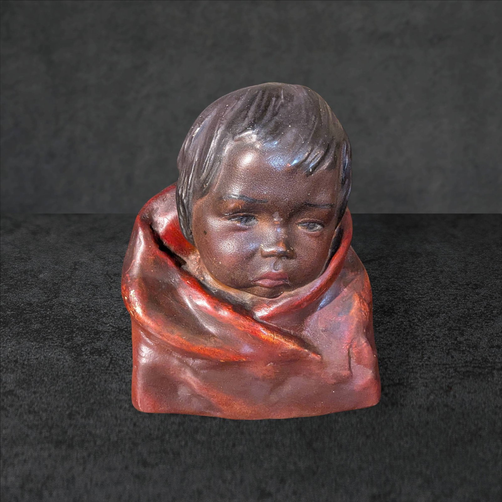 Early 1900s Esther Hunt â€˜Pomoâ€™ Polychrome Chalkware Child Bust Figurine: Polychrome chalkware child bust figurine titled 'Pomo,' crafted and copyrighted by Esther Hunt in the early 1900s. Features intricate painted details and expressive characteristics. Signed 'Esther Hun