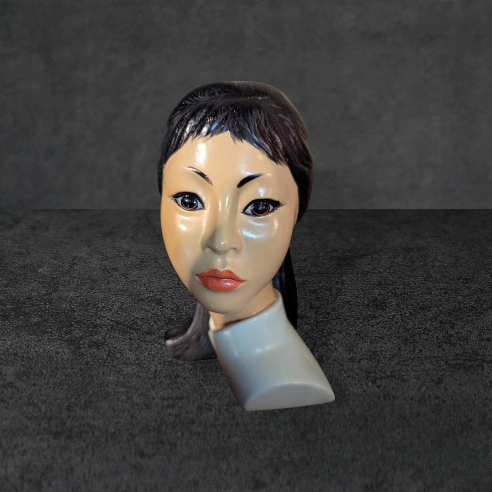 Vintage 1965 Brower Marwal Asian Beauty Head Bust: A 1965 Brower Marwal head bust depicting an elegant Asian lady wearing a pale mint green Mandarin-style blouse and featuring an expressive face. Her hair is styled with a decorative ornament, and the 