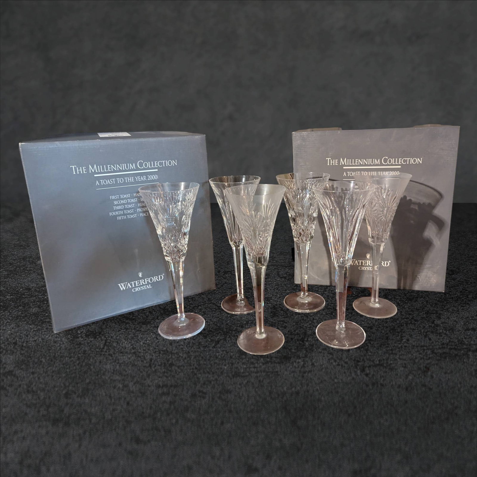 Waterford Crystal Millennium Collection Champagne Flutes, Set of 10: 10 crystal champagne flutes from the Waterford Millennium Collection, themed 'A Toast for the Year 2000.' Features include intricate cut details representative of Waterford craftsmanship. Includes ori