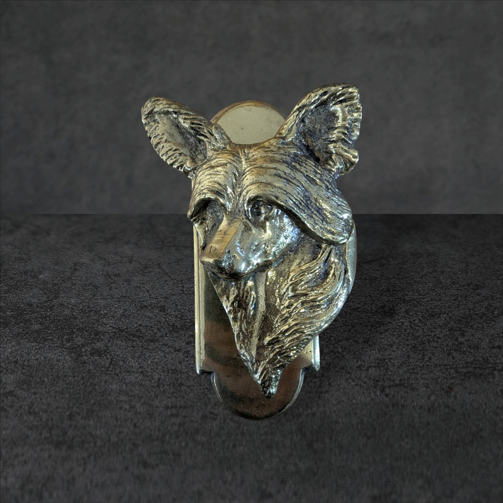 Chinese Crescent Dog Brass Door Knocker, 6.5 Inches Tall: Brass door knocker in the form of a Chinese crescent dog head. Standing 6.5 inches tall, the piece features intricate detailing on the dog's face and ears, with a flat mounting plate on the back. The 