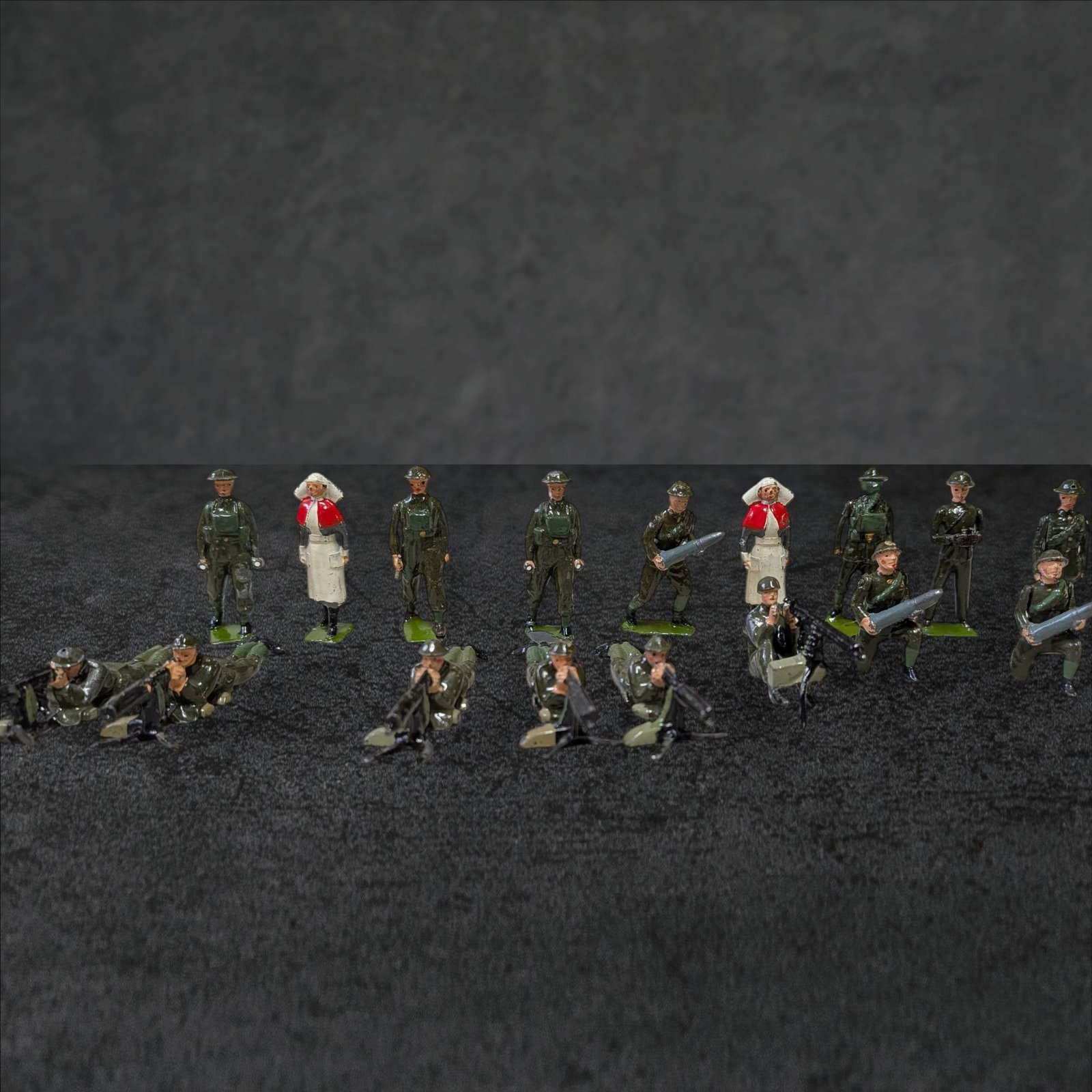 Articulating World War I Figures by Britain LTD in Early John Wanamakerâ€™s Box: A collectible set of articulating World War I figures, manufactured by Britain LTD in England. Includes multiple painted military figures in detailed uniforms, some posed in action with weapons. The f