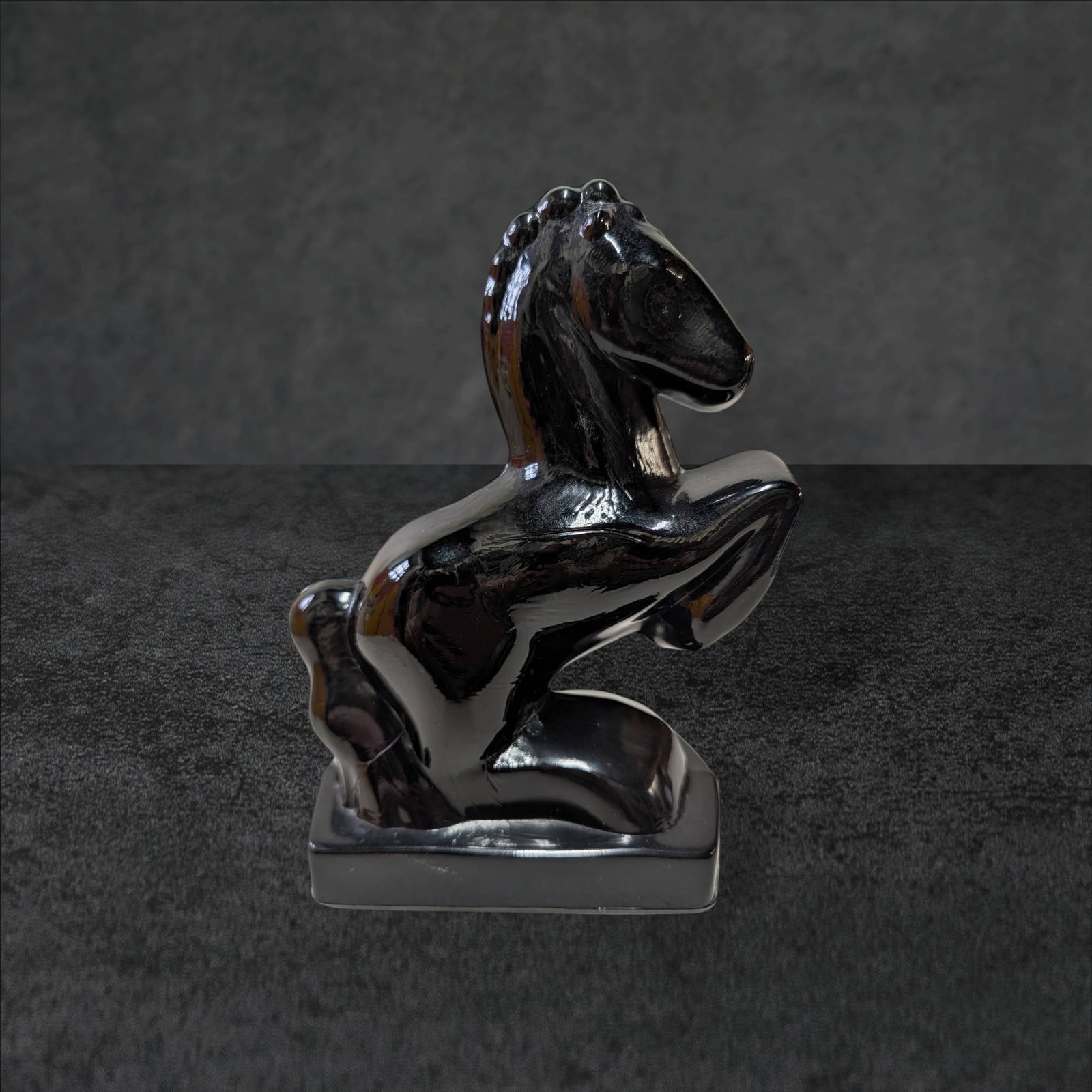 Ellie Smith Amethyst Glass Horse Figurine, 8-Inch: Ellie Smith amethyst glass horse figure standing 8 inches tall on a rectangular base. Measuring approximately 5 inches deep by 3 inches wide, this piece showcases a prancing horse with a glossy, dark 
