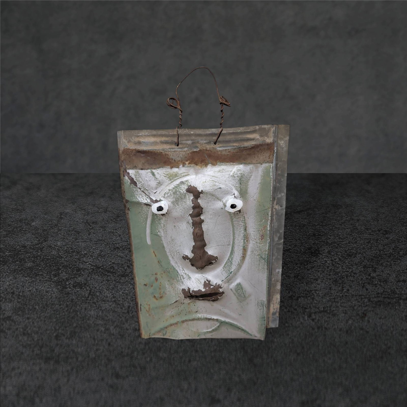 Metal Wall Art Sculpture by Alabama Artist, Signed, 14Ã—9.5 Inches: Metal wall art sculpture depicting an expressive human face crafted from repurposed sheet metal. Signed on the back by the artist, with the signature indicating 'BA, Bobbie Adams, Seale, Alabama.' Fea