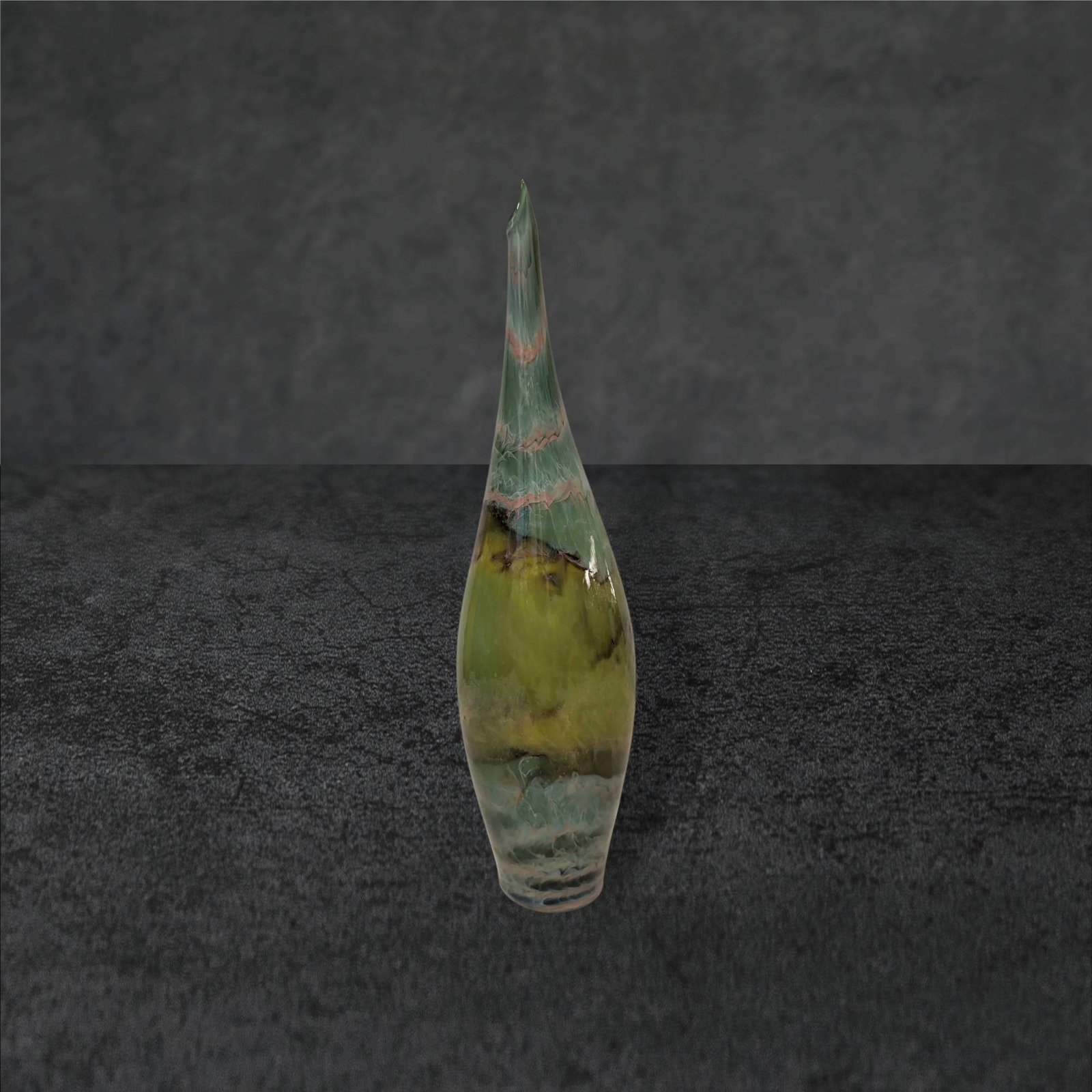 12â€³ Tall Art Glass Vase with Swirled Green and Brown Design: Art glass vase measuring 12 inches in height, featuring an elegant elongated form with a pointed tip. The body showcases a swirled green and brown design, with subtle transitions between hues and natu