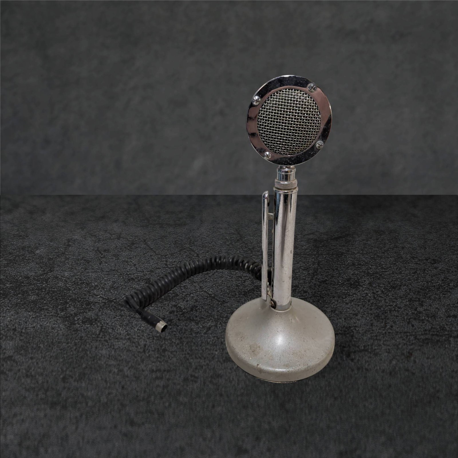Vintage Astatic D-104 Chrome and Metal Microphone with 12-Inch Tall Base: A vintage Astatic D-104 microphone, manufactured by the Astatic Corp., Conneaut, Ohio, USA. The chrome and metal model features a round metal base, measuring 12 inches tall with a 5.5-inch diameter. A
