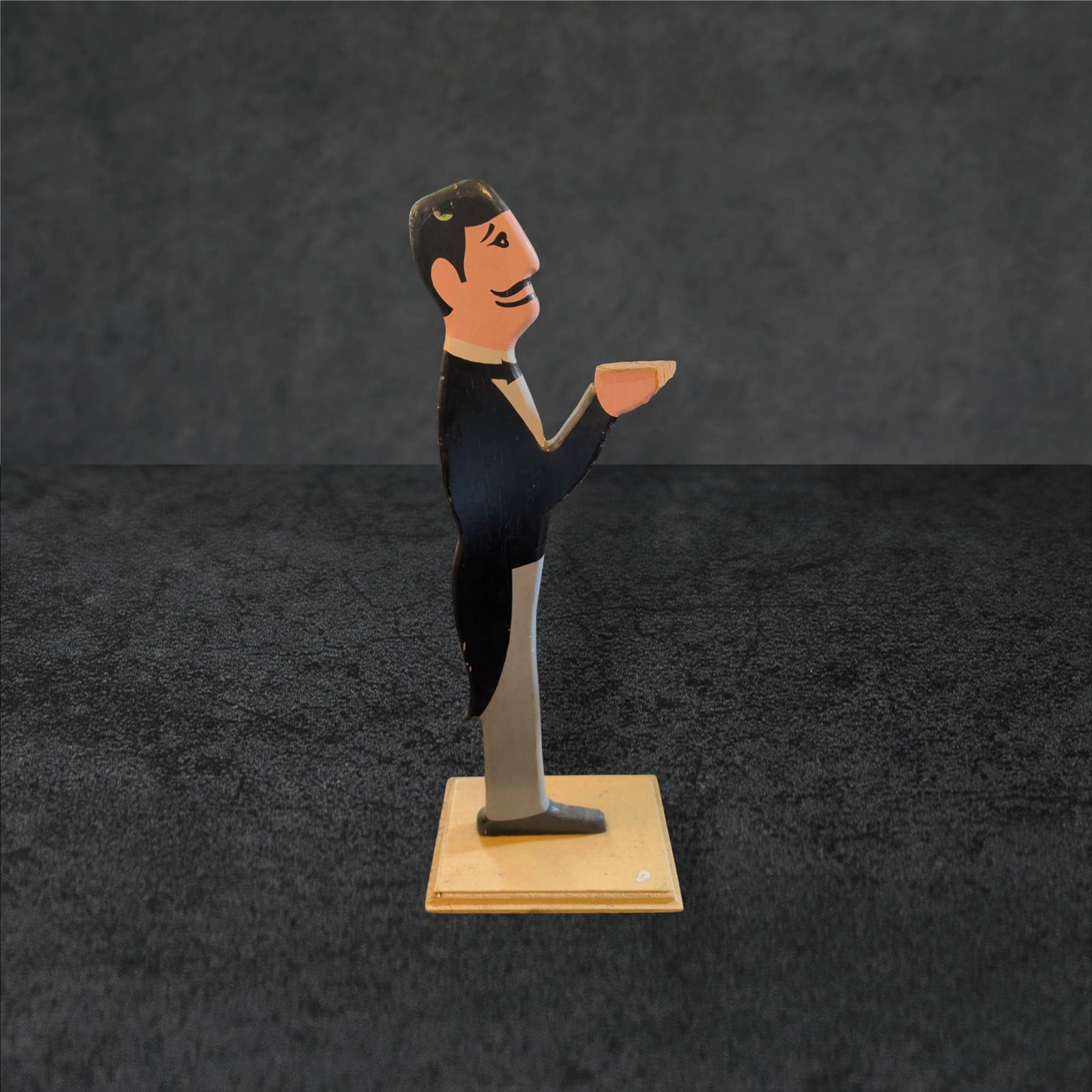 Art Deco Hand-Painted Pine Butler Figurine, 31 in. Tall: Art Deco-style hand-painted pine butler figurine standing 31 inches tall. The base measures 12 x 8 inches. Features a detailed depiction of a butler in formal attire, holding a tray. The paintwork exh