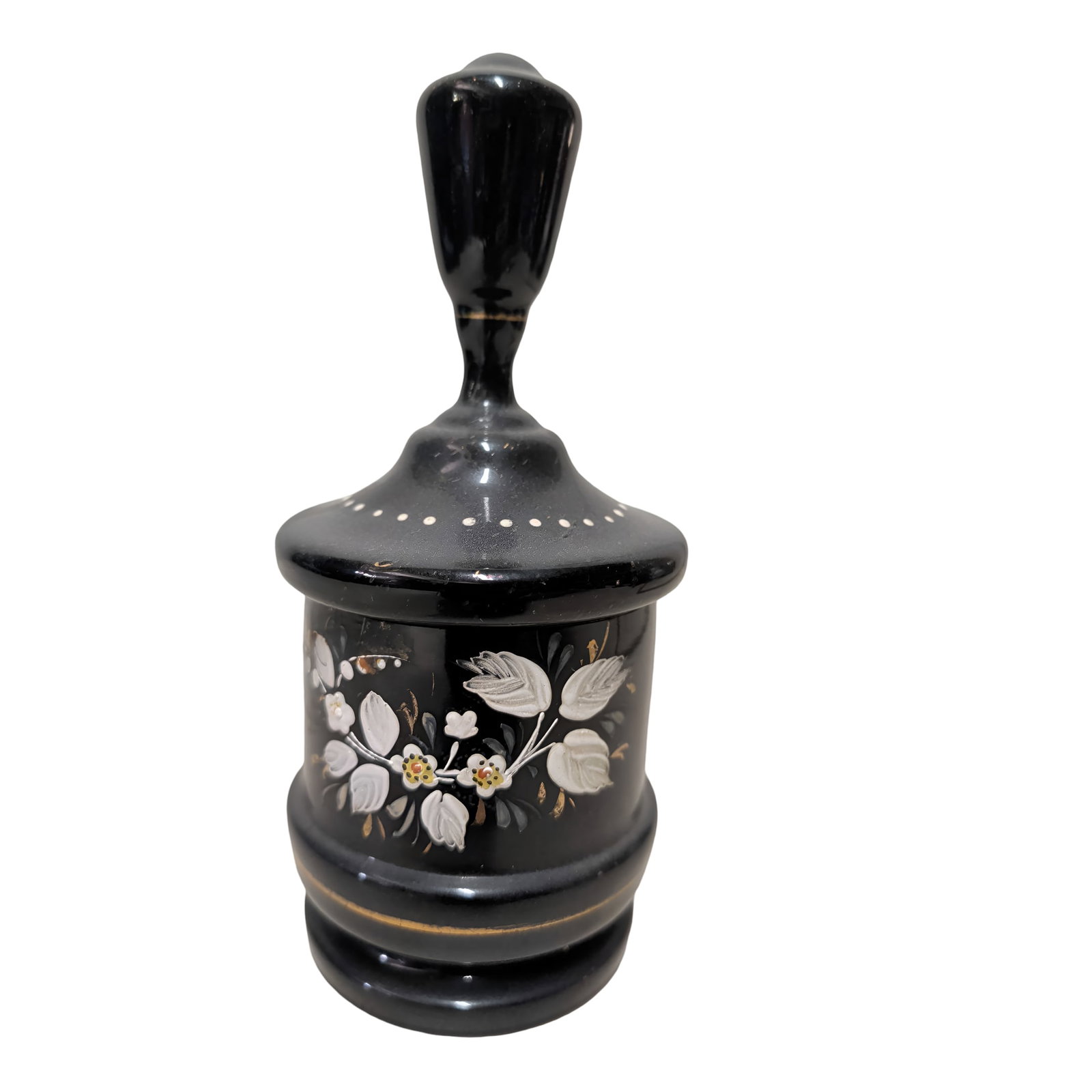 Black Amethyst Glass Vanity Jar with Lid, 8 in Tall: Black amethyst glass vanity jar measuring 8 inches tall and 3.5 inches in diameter. Features a round base, a fitted lid with a tall finial, and hand-painted floral designs with white, green, and gold