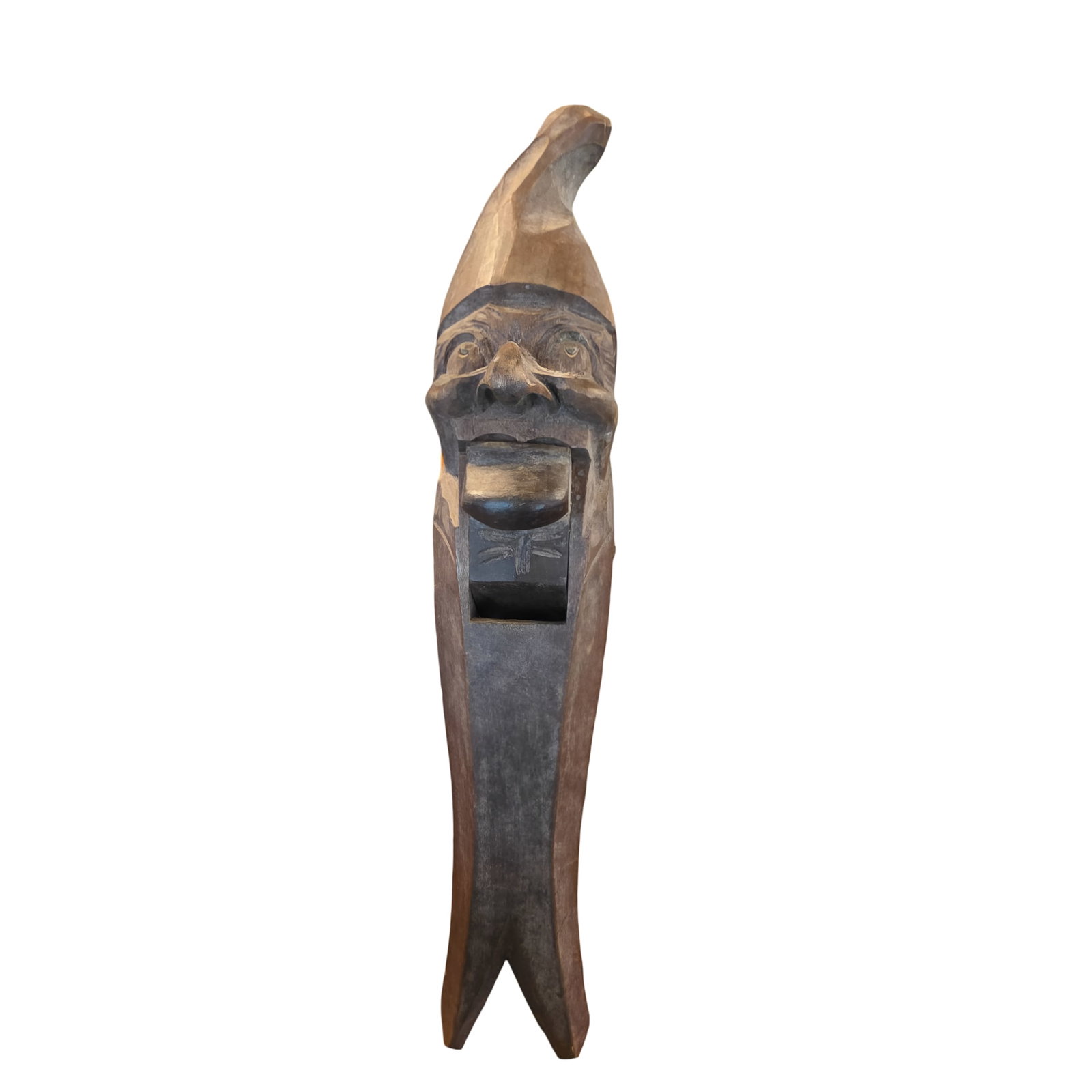Antique Black Forest Hand-Carved Wooden Nutcracker with Grotesque Face Motif: Antique Black Forest nutcracker intricately hand-carved from wood, featuring a grotesque face motif with expressive detailing. The figure includes a pointed cap and a hinged lever mechanism for