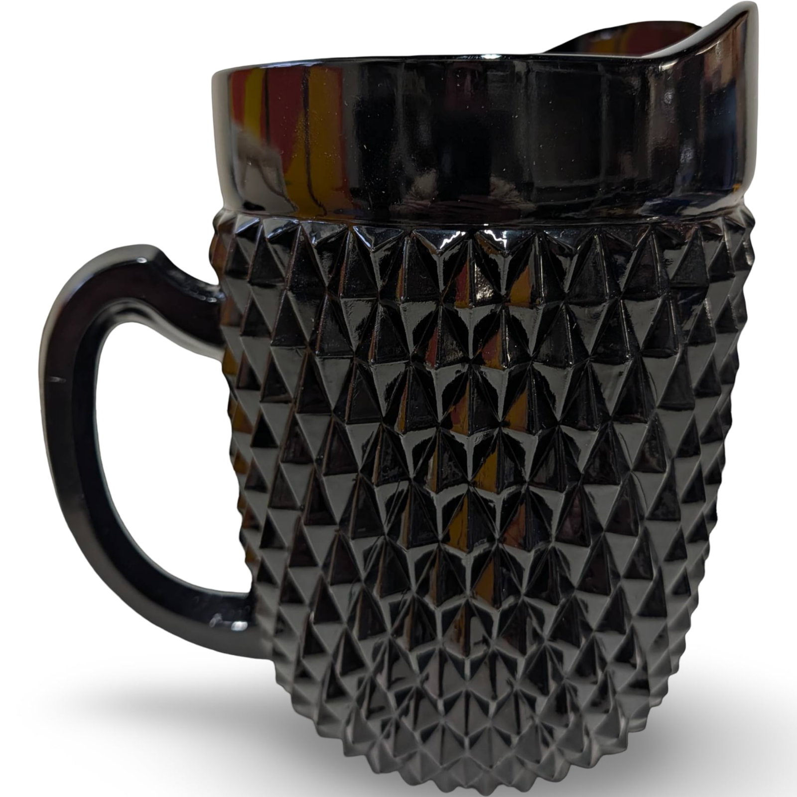 Vintage Black Diamond Point Tea Pitcher by Tiara Indiana Glass, 8 1/4 in Tall: Vintage black glass tea pitcher manufactured by Tiara Indiana Glass in the Diamond Point pattern. Measures 8 1/4 inches tall and 5 1/4 inches in diameter. Features a textured diamond-point pattern, a 