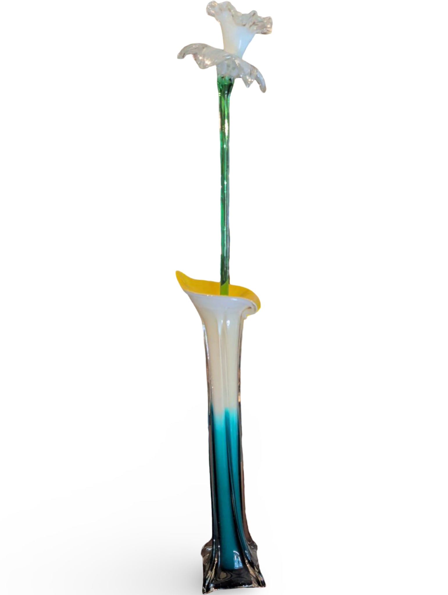 27-Inch Tall Hand-Blown Glass Vase with Floral Accents: A 27-inch tall hand-blown glass vase featuring a slender, elongated form with a flared mouth and decorative floral-like elements at the top. The vase displays a gradient of colors from green to clear 