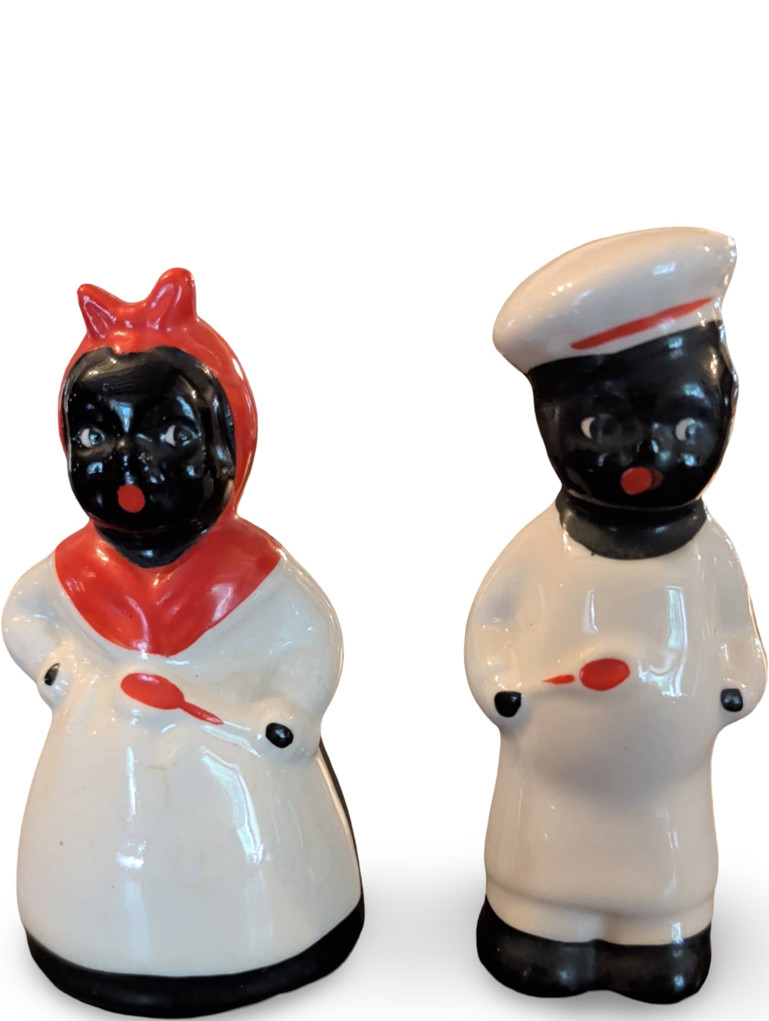 Ceramic Figural Salt and Pepper Shakers, 4 1/2 Inches Tall: Two ceramic salt and pepper shakers, each 4 1/2 inches tall. Features figural designs with hand-painted details. Both shakers include stopper inserts at the base for filling. Wear consistent with age 