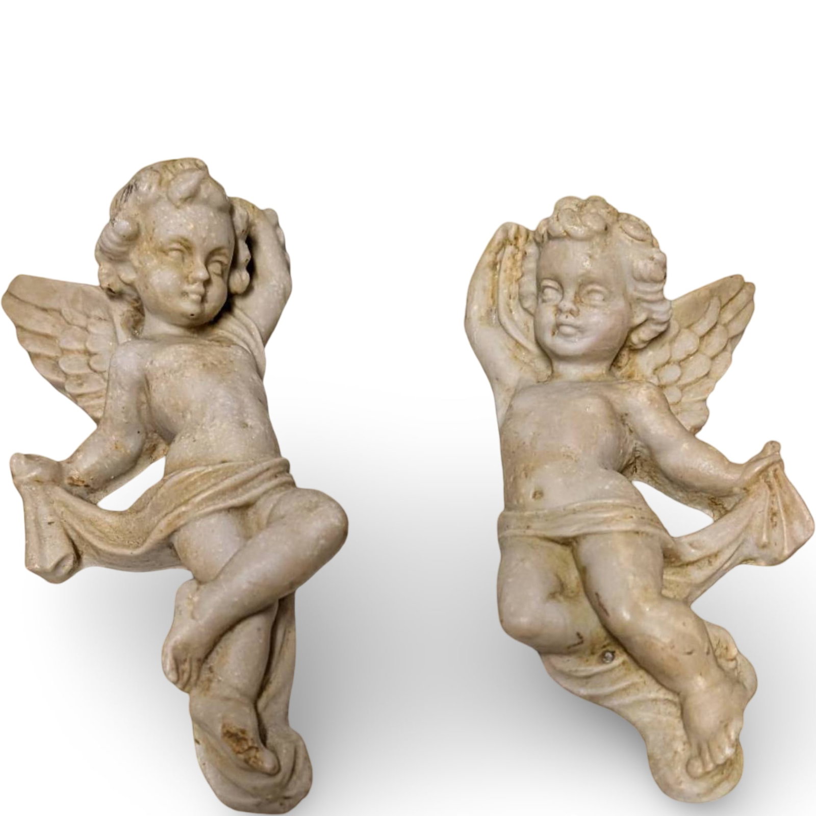 Resin Cherub Wall Hangers, Made in Mexico, 6 in x 3 in: Resin cherub wall hangers made in Mexico. Each piece measures approximately 6 inches long and 3 inches wide. Features detailed cherubic figures with wings, one holding a ribbon and the other a drape. 