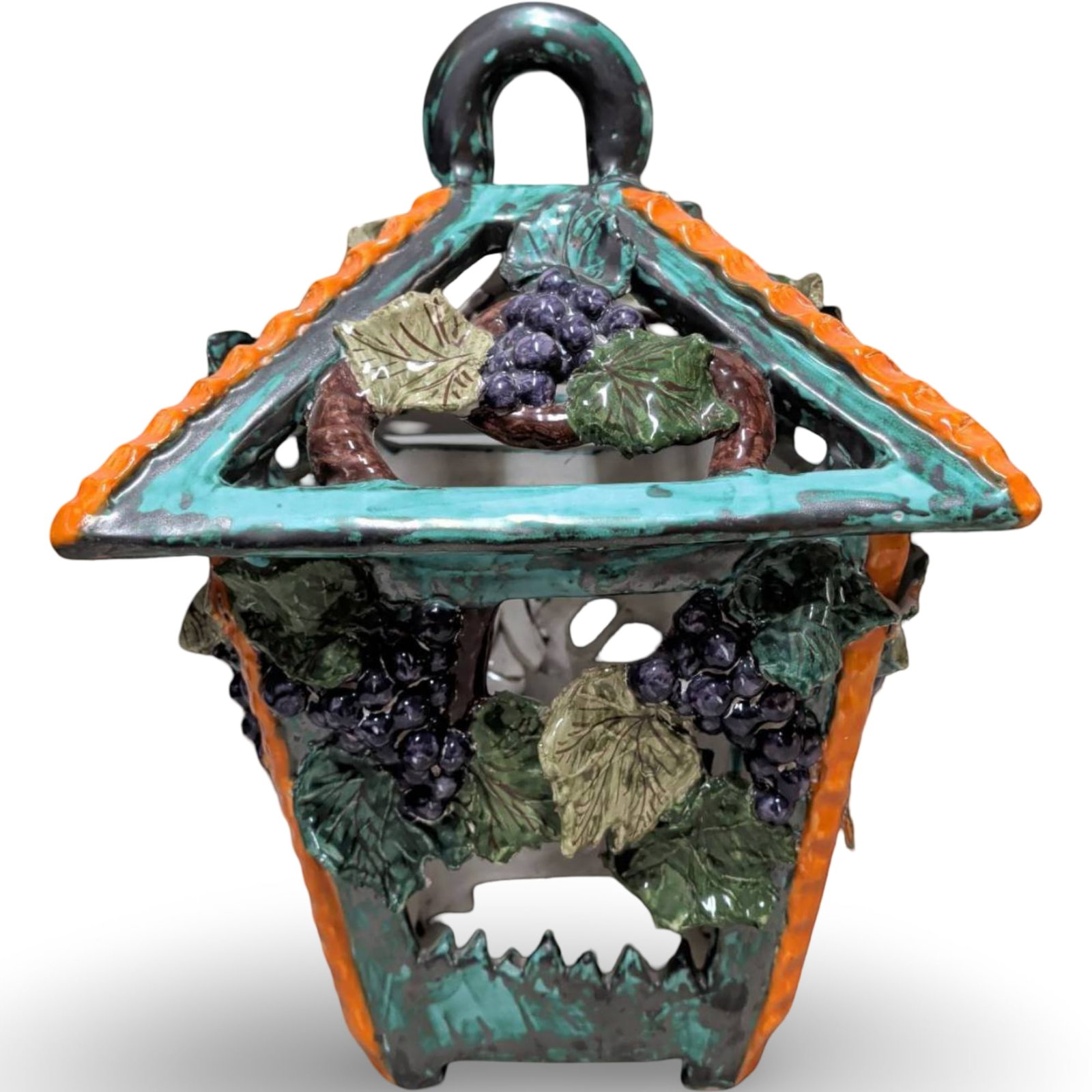 Large Ceramic Lantern with Grapevine Motif, 17 in. Tall: Large ceramic lantern featuring a vibrant grapevine motif with leaves and clusters in vivid colors. Measures 17 inches tall, 13 inches wide, and 12.5 inches deep. The triangular roof includes a loop h