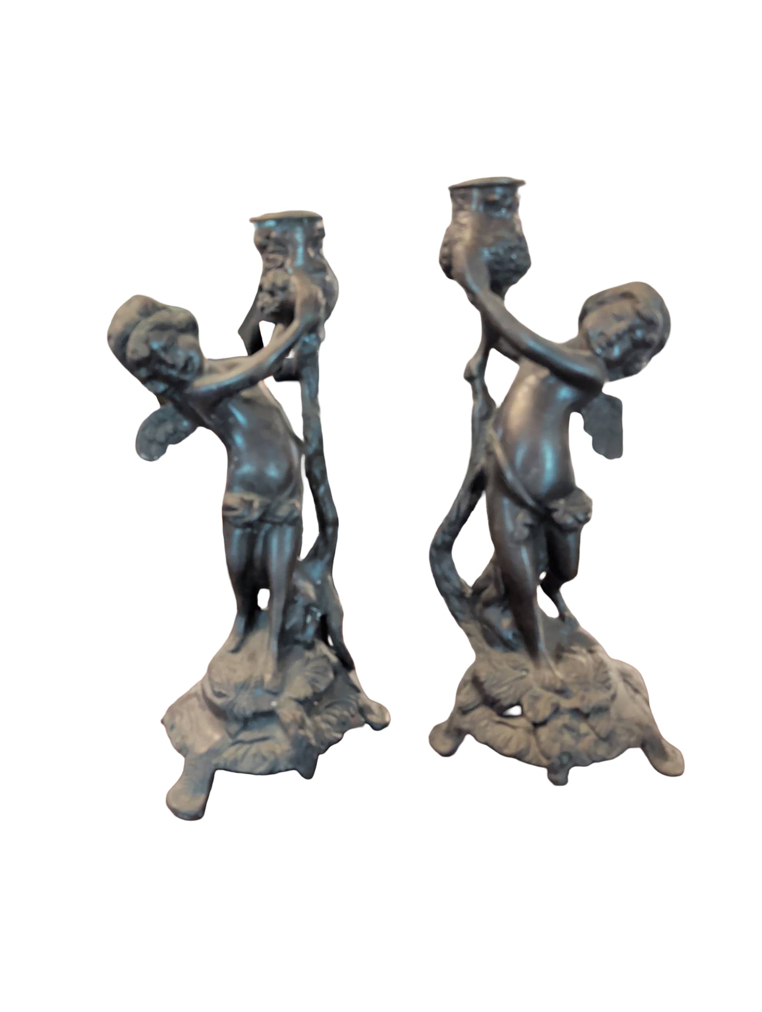 Bronze-Colored Metal Cherub Candlestick Holders, 11 Inches Tall: Candlestick holders in a bronze-colored metal finish, each featuring a cherub figure holding a central candlestick. The bases are ornately detailed with flowing designs, standing stably on three legs.