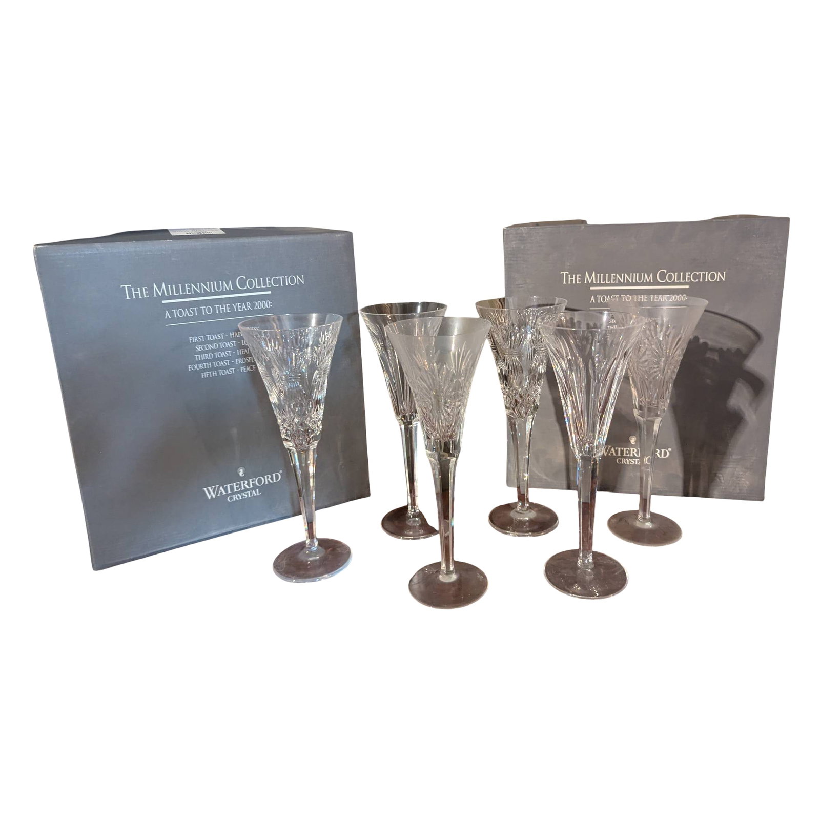 Waterford Crystal Millennium Collection Champagne Flutes, Set of 10: 10 crystal champagne flutes from the Waterford Millennium Collection, themed 'A Toast for the Year 2000.' Features include intricate cut details representative of Waterford craftsmanship. Includes ori