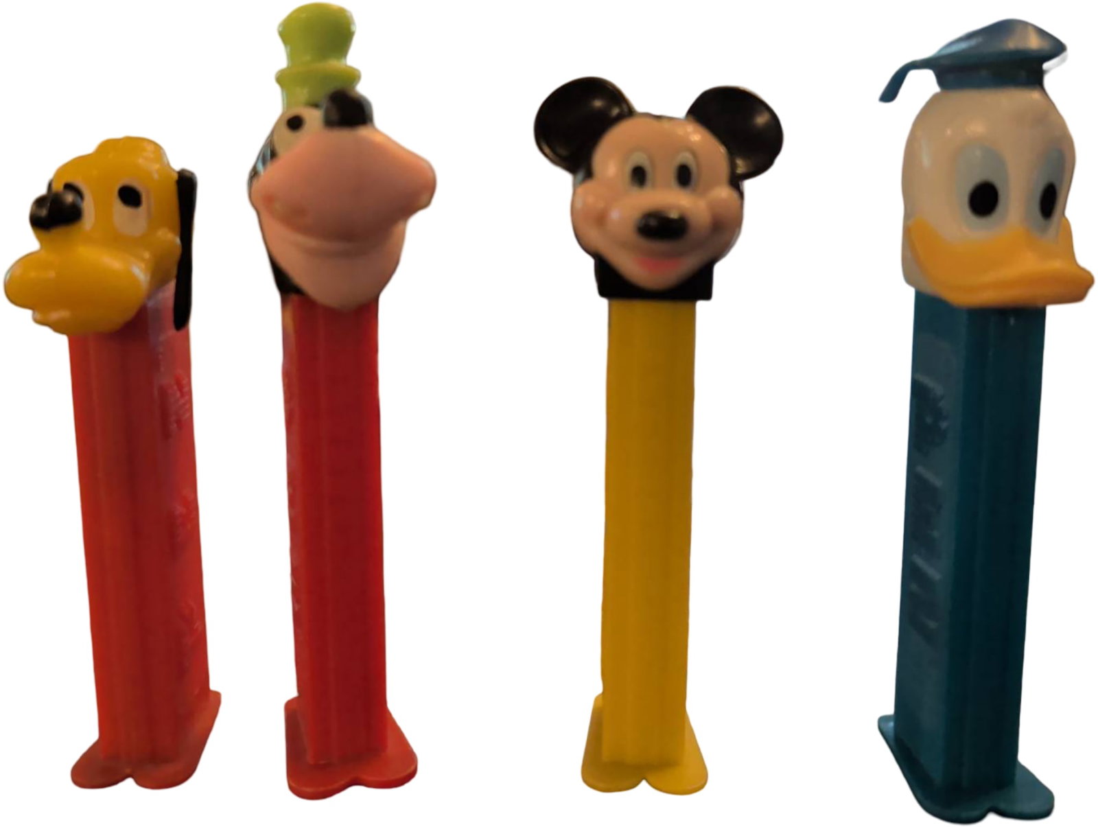 Four Disney Character PEZ Dispensers Featuring Mickey, Goofy, Donald, and Pluto (1 of 2)