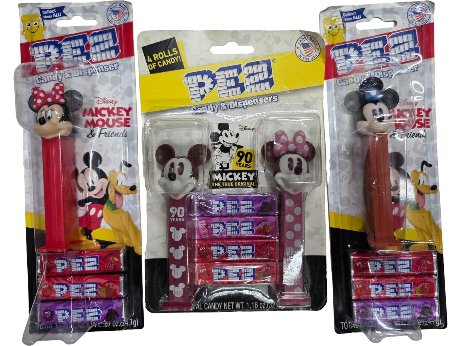 4 PEZ Dispensers Featuring Mickey and Minnie Mouse with Candy Refills: Four PEZ dispensers with designs featuring Mickey and Minnie Mouse. The dispensers come in sealed packaging, each accompanied by candy refills. Includes two individually packed dispensers and one set