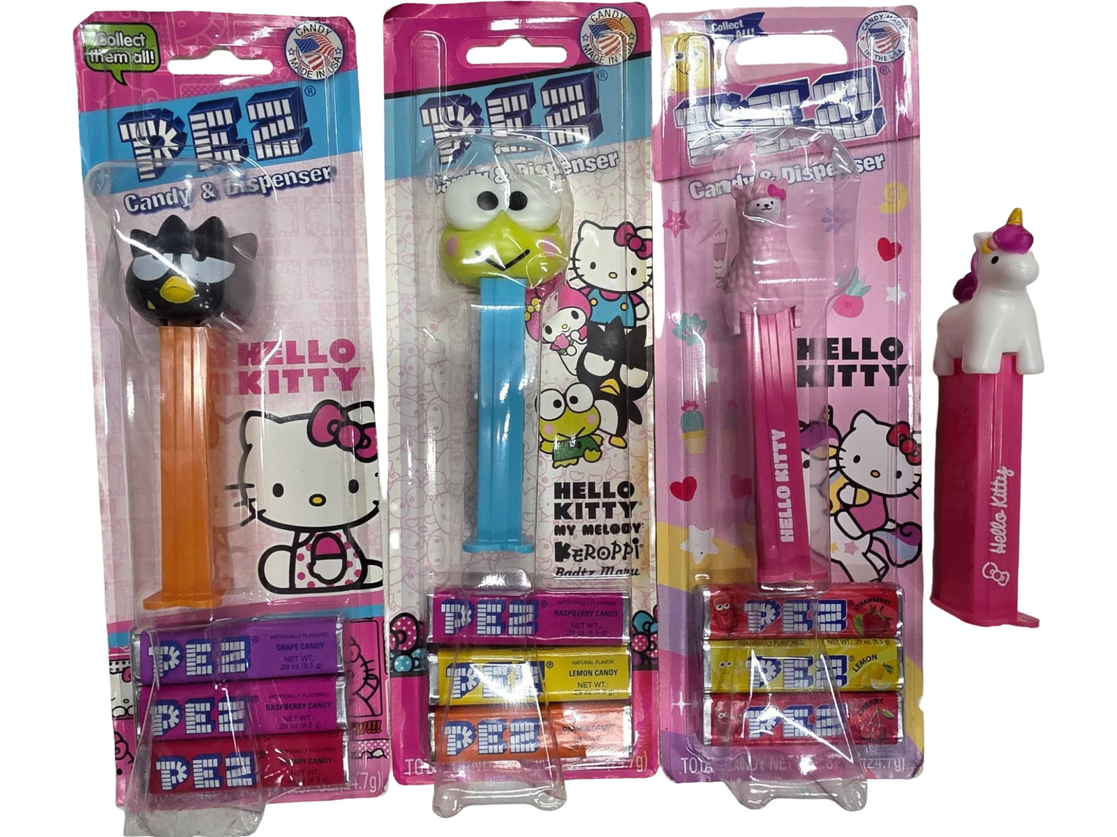 4 Hello Kitty and Character PEZ Dispensers, Including One Loose Dispenser: Four PEZ candy dispensers featuring Hello Kitty and other themed characters. Three dispensers are factory-sealed in original packaging, and one Hello Kitty-themed dispenser is loose. Packaging include