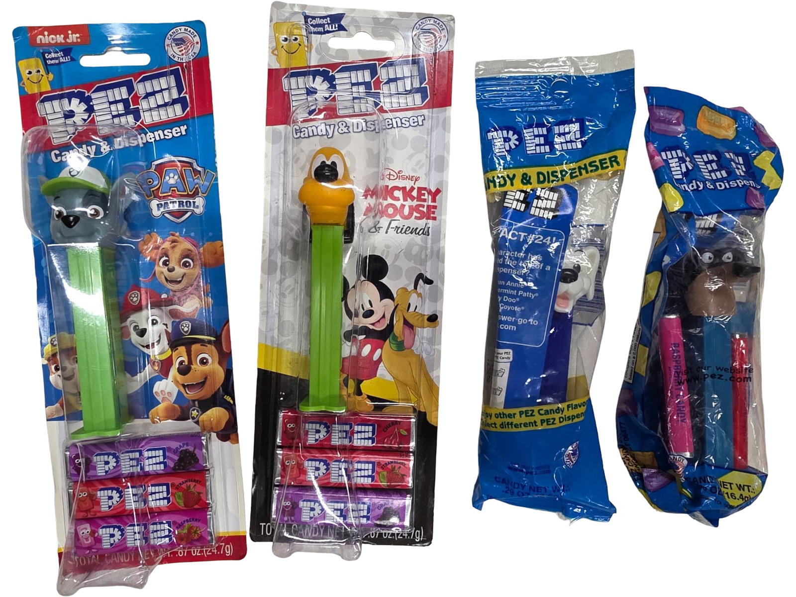 4 Assorted Dog-Themed PEZ Dispensers in Original Packaging: 4 dog-themed PEZ candy dispensers, each in unopened original packaging. Characters include Rocky from Paw Patrol and Pluto from Mickey Mouse Clubhouse, lucky from 101 Dalmatians and Buddy From the
