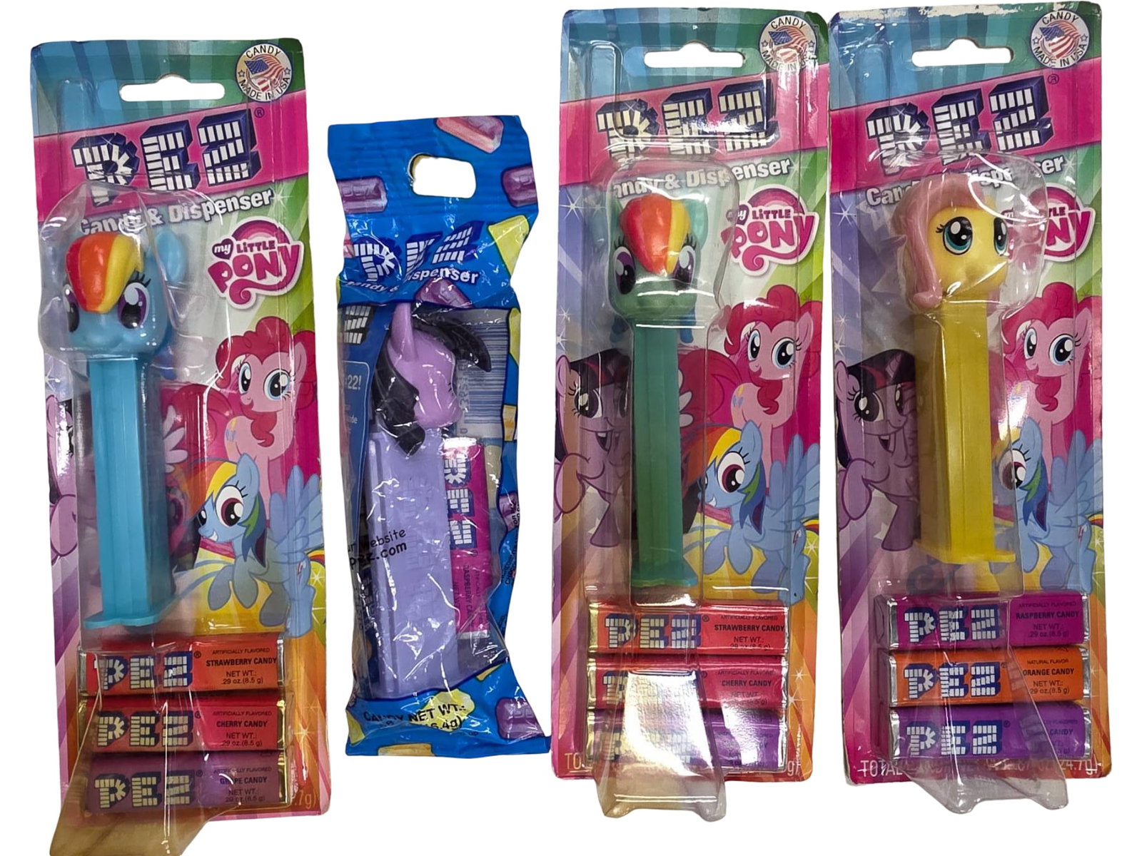 4 My Little Pony Themed PEZ Dispensers in Original Packaging: Four My Little Pony-themed PEZ dispensers, each paired with candy refill packs. Characters featured include Rainbow Dash, Flutter shy, and Twilight Sparkle. All dispensers are sealed in original