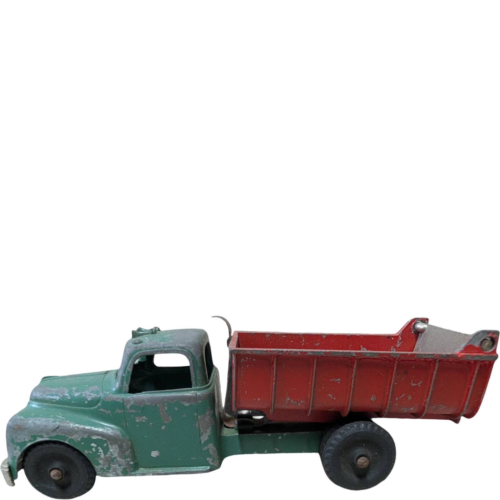 Vintage 1950s Hubley Kiddie Toy Green and Red Dump Truck with Lever: Cast iron Hubley Kiddie Toy dump truck from the 1950s, featuring a green cab and red dump bed with operating lever. Approx. 5.5 inches in length. Paint shows wear and minor chipping consistent with