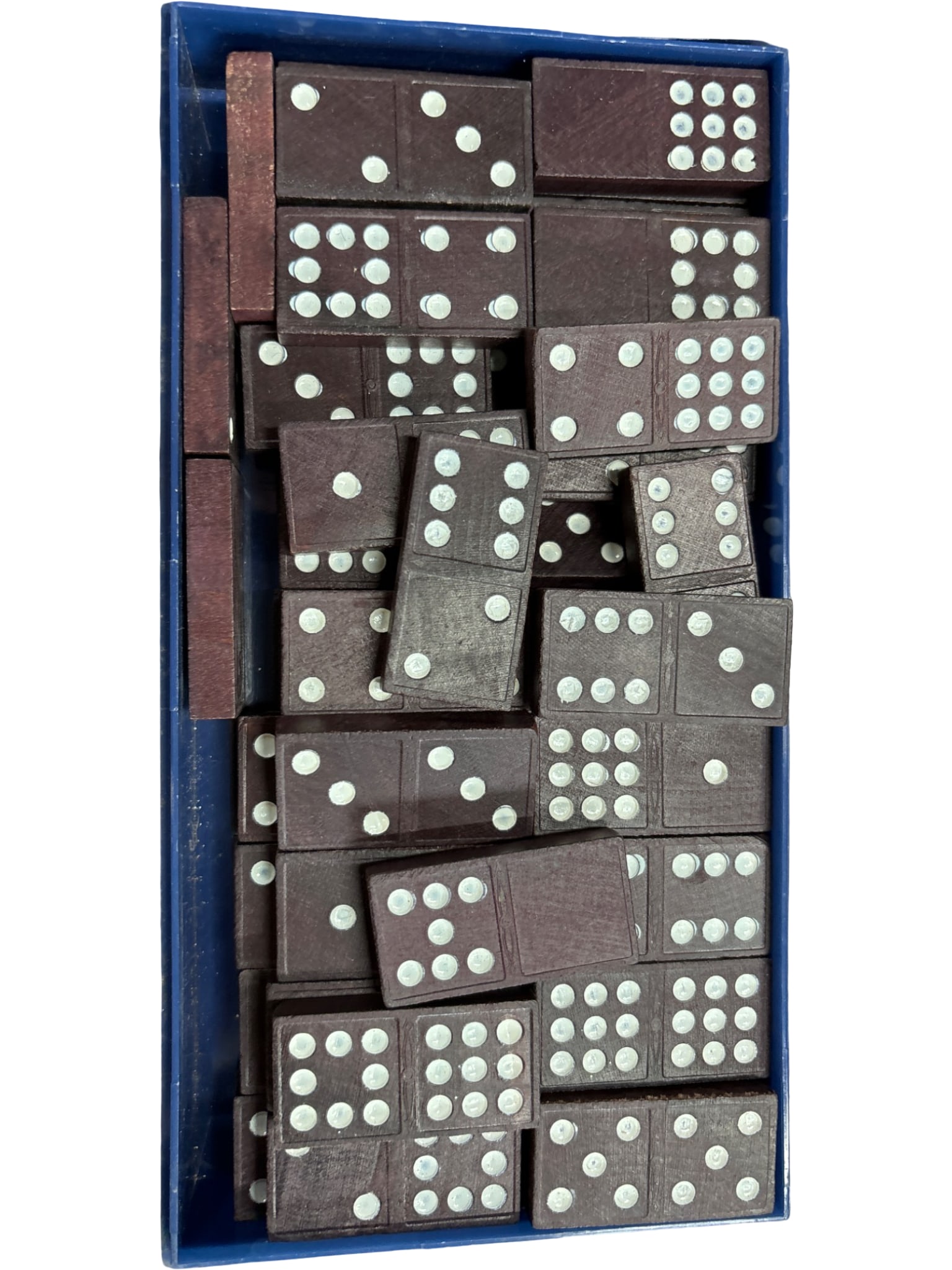 Carved plastic Dominoes in Blue Plastic Case: A complete set of plastic dominoes featuring carved decorative designs on one side and white inset dots on the game-playing side. The set comes in a rectangular blue plastic case with a hinged lid, ma