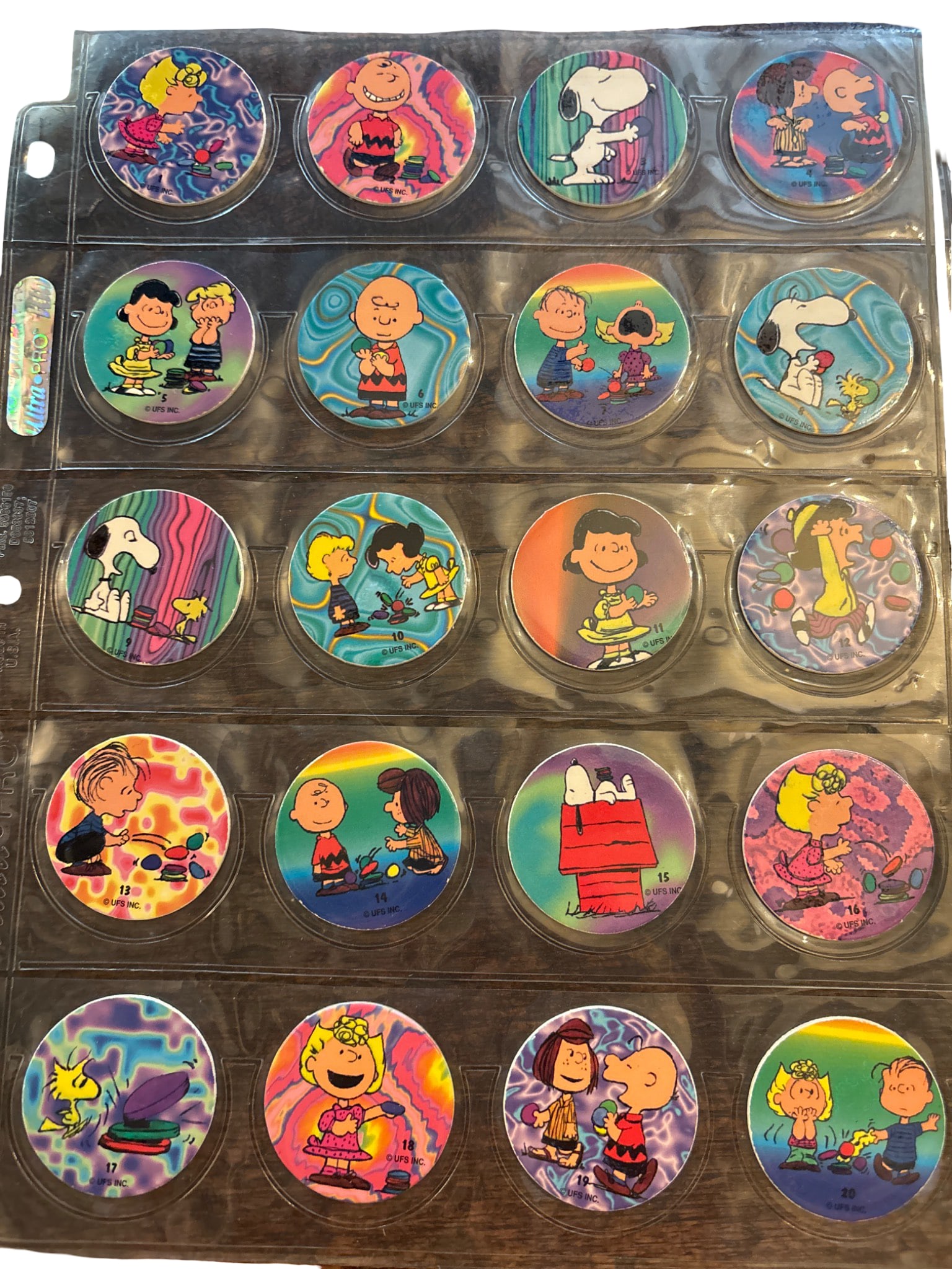 Pog Milk Cap Discs Featuring Peanuts Characters with tie dye background (1 of 2)