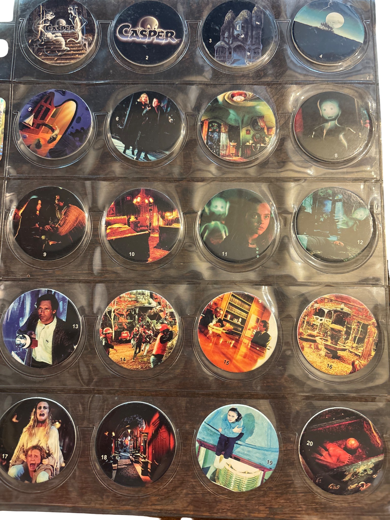 Complete Set of Casper Movie Pogs (1-140), 1995 Universal Studios Collection: Comprehensive collection of 140 Casper movie pogs, numbered 1-140, released in 1995 by Universal Studios and Amblin Entertainment. Includes full-color and black-and-white designs depicting characters 