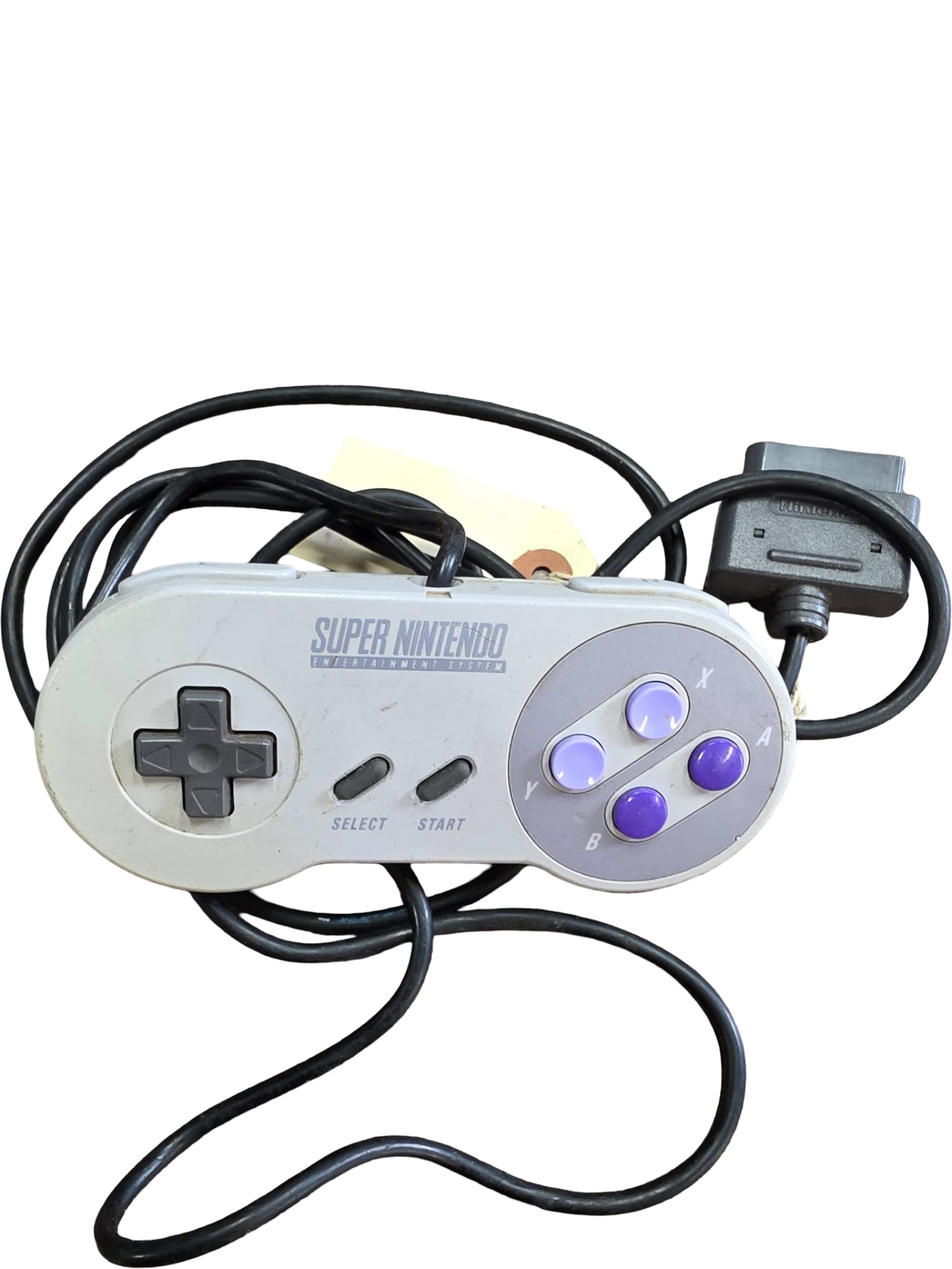 Super Nintendo Entertainment System (SNES) Wired Controller: An original Super Nintendo Entertainment System (SNES) wired controller featuring the classic gray and purple button layout. Includes a directional pad, four action buttons, and start/select buttons.