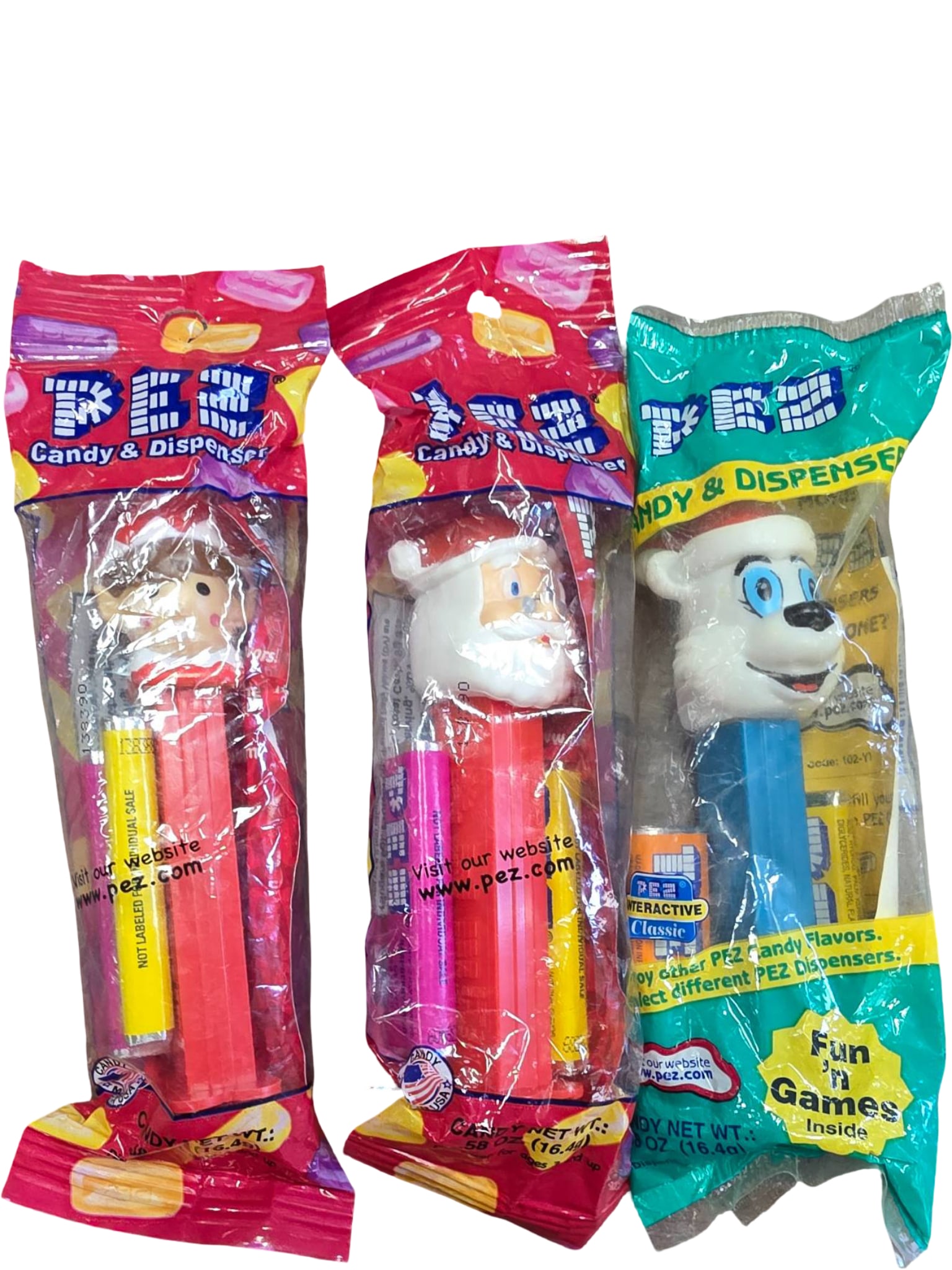 Three PEZ Dispensers in Original Packaging Featuring Santa, Elf, and Polar Bear Characters (1 of 1)