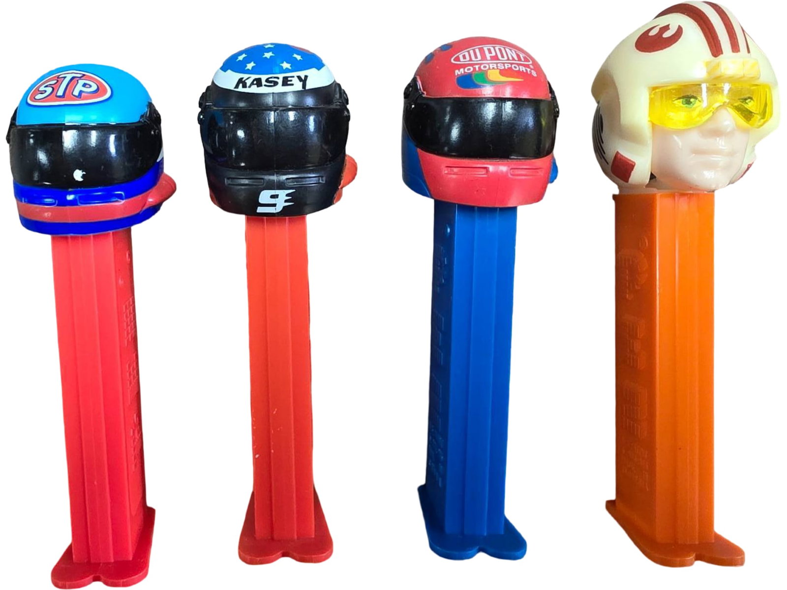 Four PEZ Candy Dispensers Featuring Nascar Racing Helmets and Star Wars Design (1 of 1)