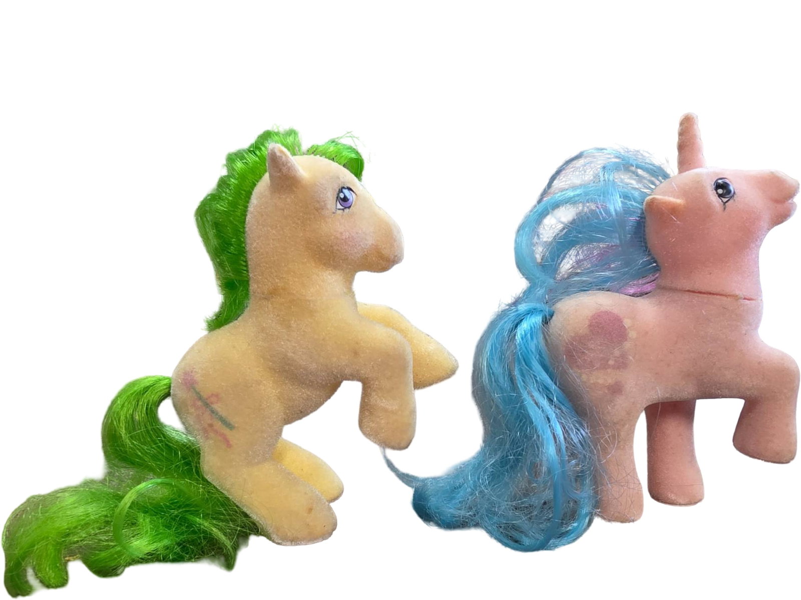 Two Hasbro Vintage My Little Pony Plush Figures: Two Hasbro vintage My Little Pony So Soft figures, featuring Bangles and Magic Star. Both feature painted eyes and characteristic My Little Pony symbols on their sides. Some wear to fabric and hair co