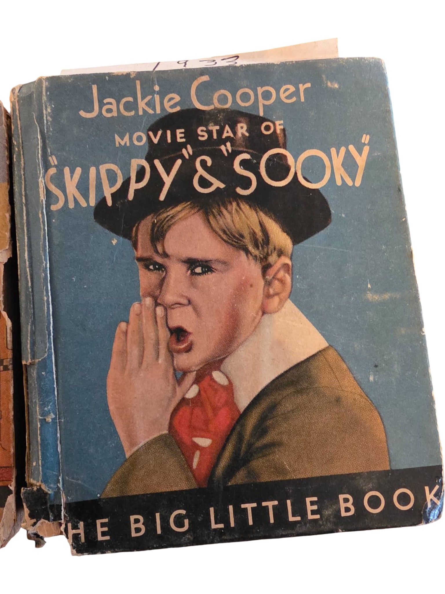 Vintage ‘Skippy & Sooky’ Big Little Book Featuring Jackie Cooper: A vintage Big Little Book titled 'Skippy & Sooky,' featuring movie star Jackie Cooper. Hardcover with illustrated covers depicting Jackie on both sides. The book shows evidence of wear, including